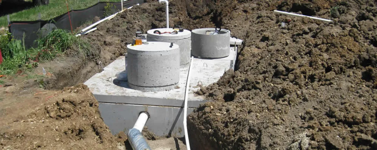 Septic system repair and installation site with tank access ports in Loveland, CO